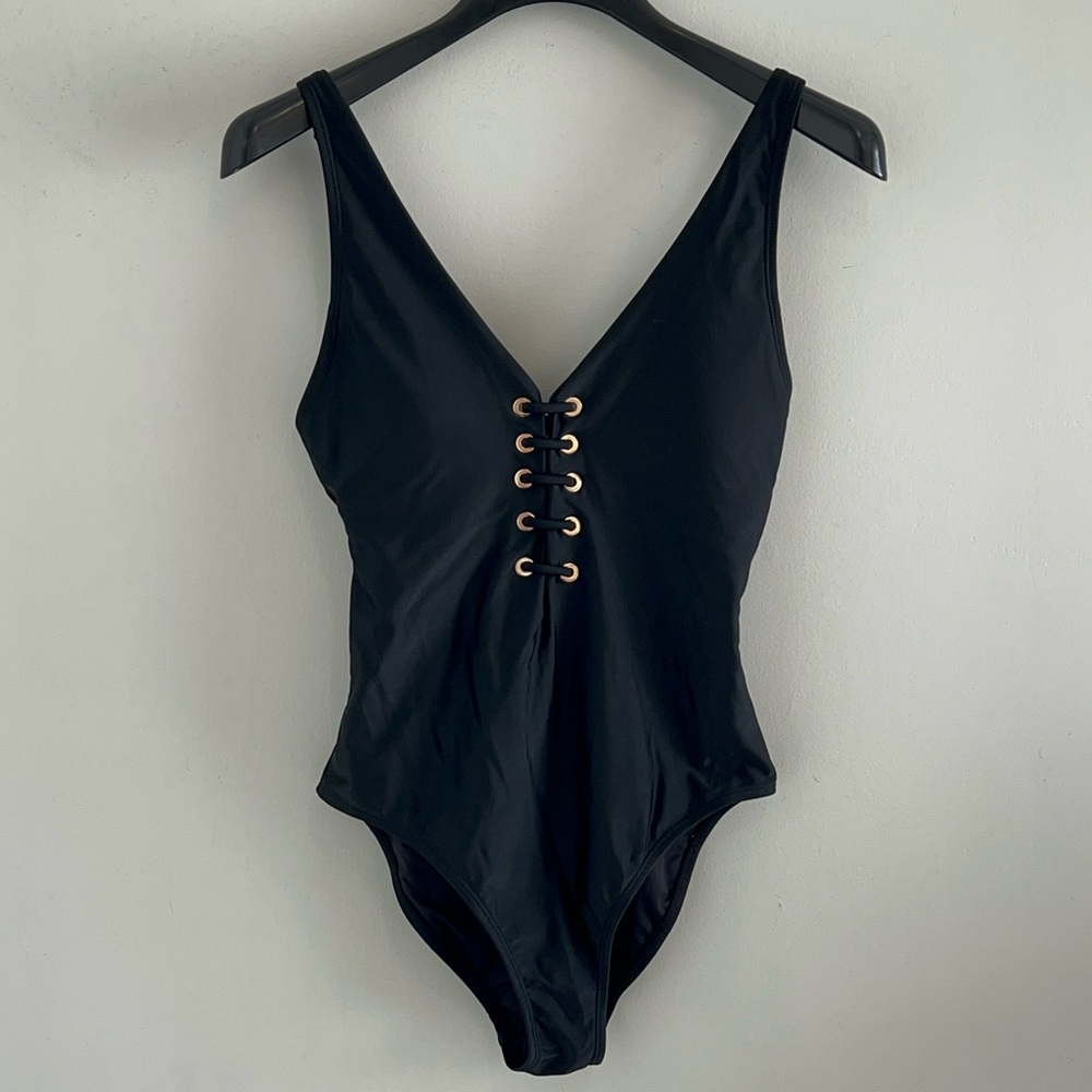 BCBGMaxAzria Women’s Lace Up V-Neck One Piece Swimsuit.